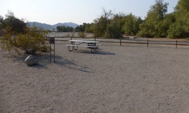 Furnace Creek Campground standard nonelectric site #112 with picnic table and fire ring.
