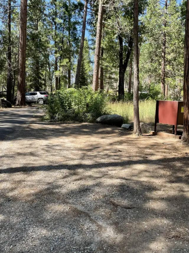 Small parking pad dirt and gravel.