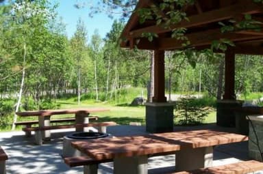 Picture of group site picnic shelter and tables.