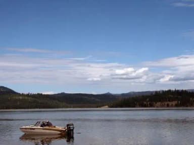 Lost Valley Reservoir with boat in foreground - near to campground.