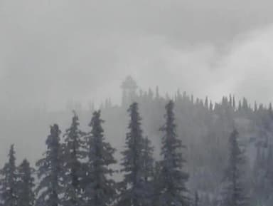 snowy lookout in the distance with fog