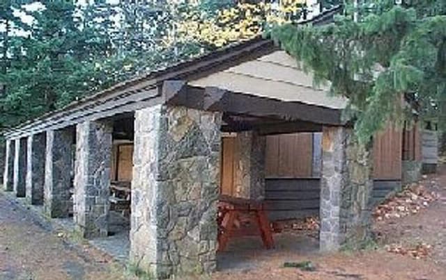 Picnic shelter with stone pillars.