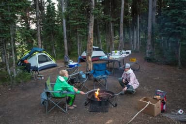 Campers roasting marshmallows at Lewis Lake Campground