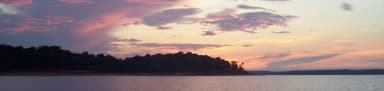 Sunset along the southern shoreline of Sardis Lake, filed by the agency against 3 campsites at Clear Creek (MS)