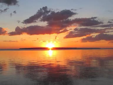 An island sunrise, filed by the agency against 14 campsites at Apostle Islands National Lakeshore Camping Permits