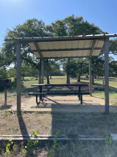 A photo of Site 32 of Loop Hippy Point at MURRELL PARK with Picnic Table, Fire Pit, Shade, filed by the agency against 2 campsites at Murrell Park